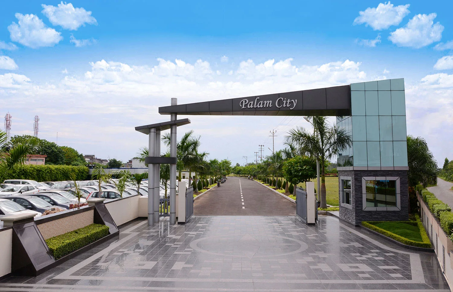 Palam City entrance and palm-lined avenue