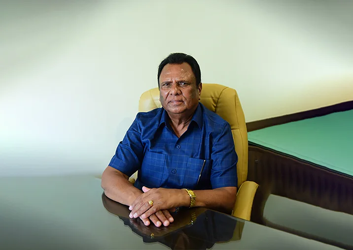 Suresh Pal seated at his desk