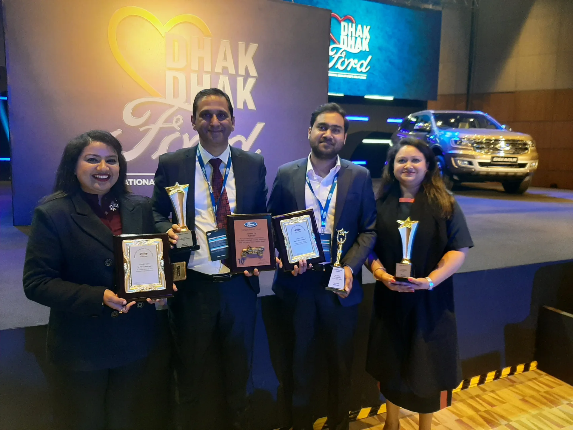 Pal Ford team accepting the Dhak Dhak award — celebrating sales excellence at the Ford dealership in Haldwani